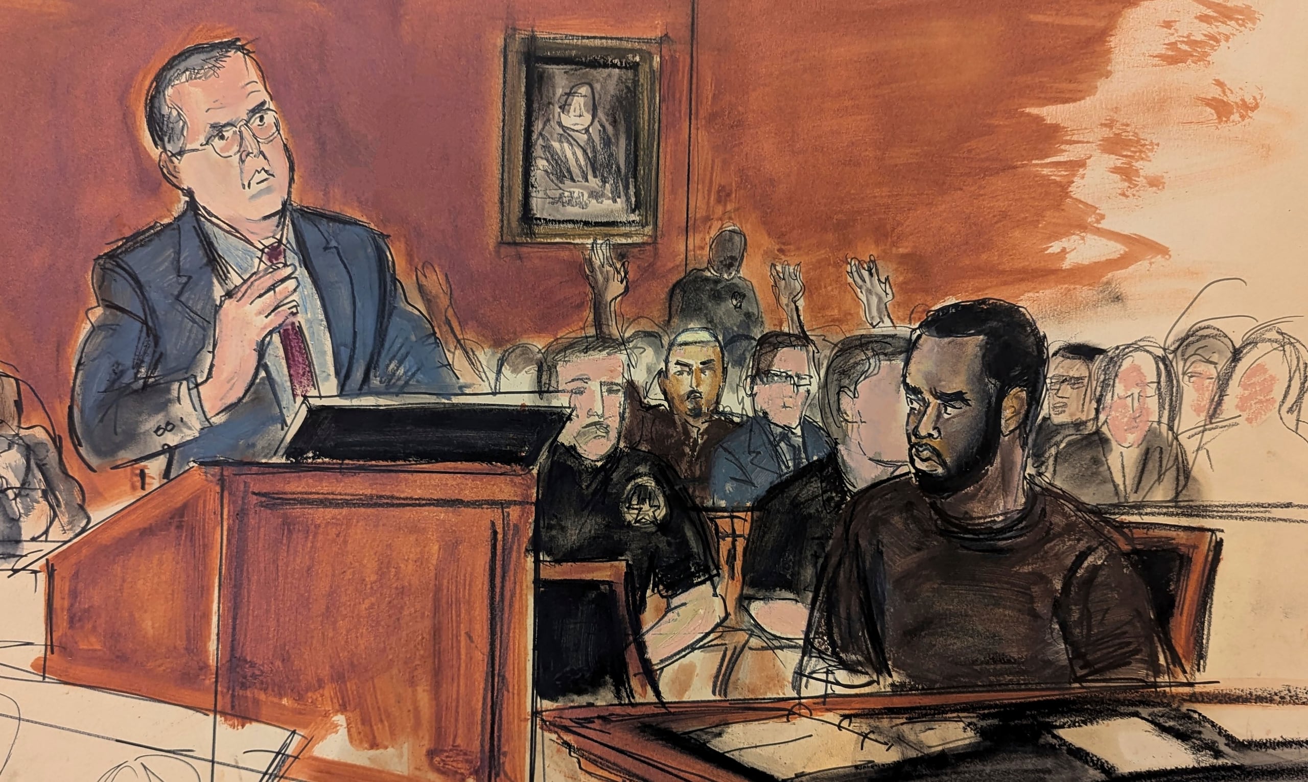 En este boceto del tribunal, Sean Combs, sentado a la derecha, mira a su abogado Marc Agnifilo, a la izquierda, mientras este presenta su argumento de fianza. La familia de Combs, en la galería al fondo, levanta las manos para indicar al juez Tarnofsky que están presentes, en apoyo al argumento de fianza del abogado defensor, el 17 de septiembre de 2024, en el Tribunal Federal de Manhattan, en Nueva York.