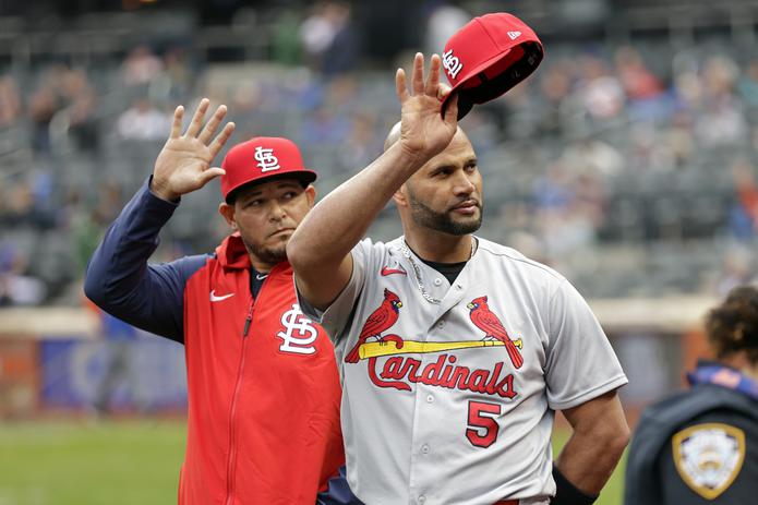 St. Louis Cardinals first baseman Albert Pujols (5) and catcher Yadier Molina acknowledge the New York Mets crowd during a pre-game ceremony before a baseball game on Thursday, May 19, 2022, in New York. (AP Photo/Adam Hunger)