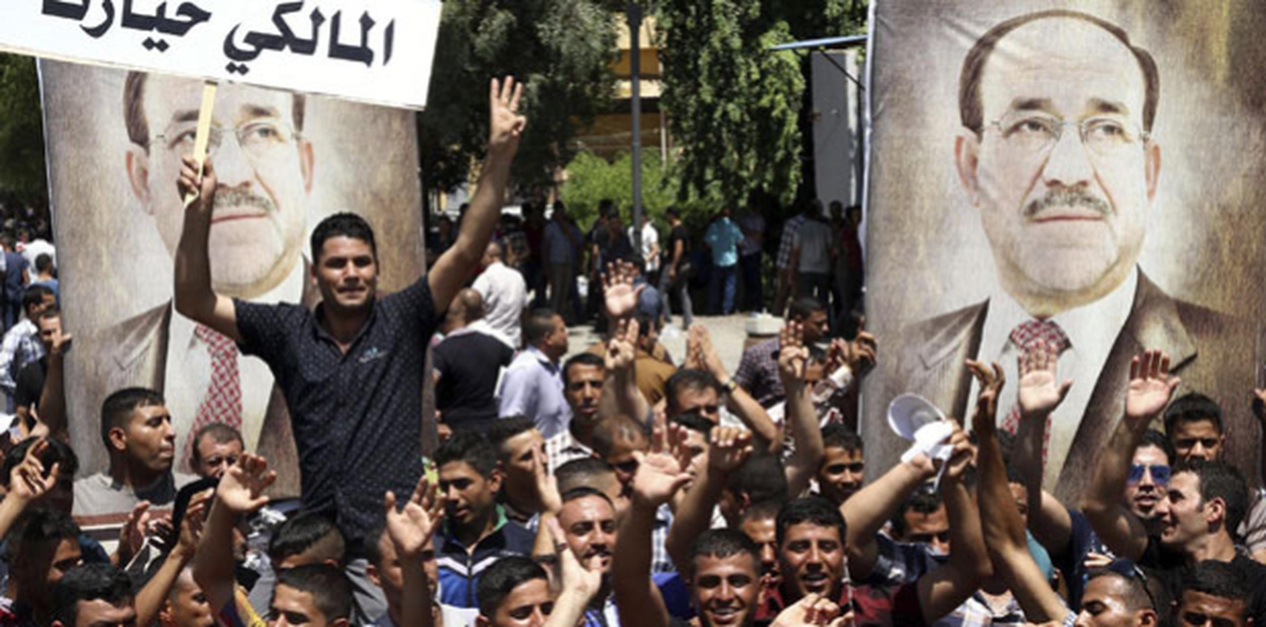 Manifestantes muestran su apoyo a Nuri al-Maliki en Bagdad, Irak. (EFE/Abbas)